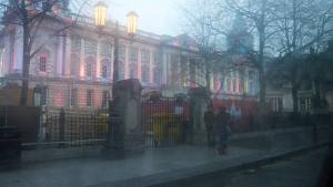 View out the foggy window at Belfast City Hall all lit up for Christmas
